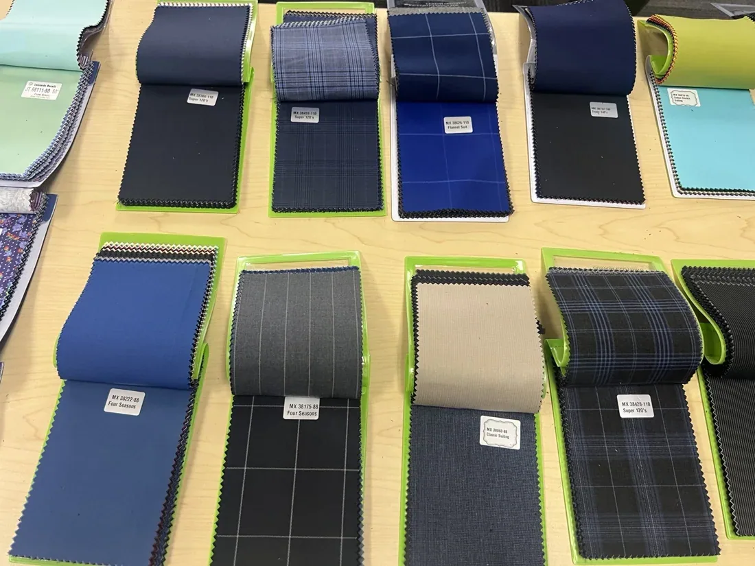Wool and linen suiting fabric books in neutral and blue tones